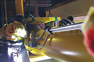 Service technician checking hydraulic systems